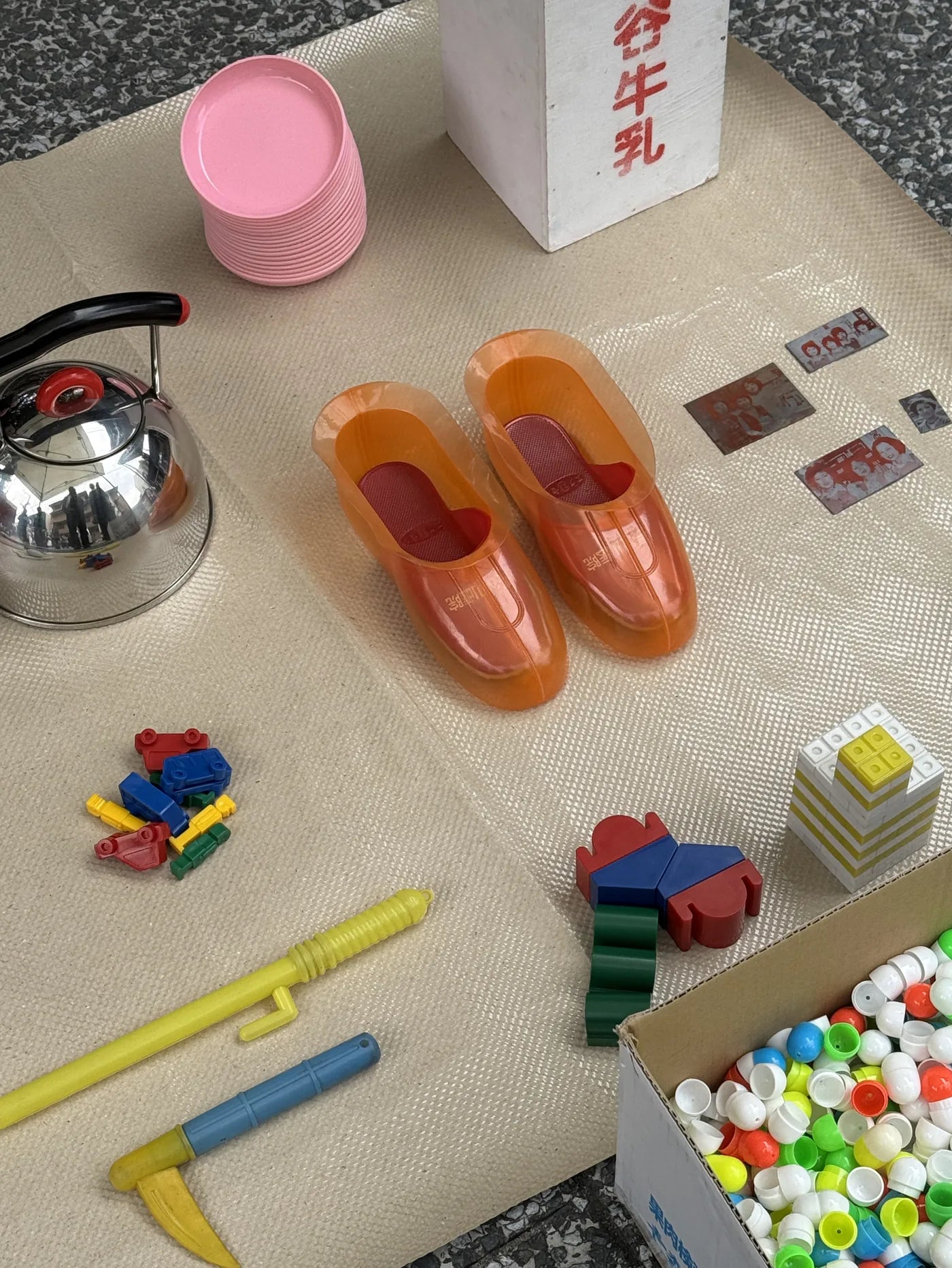 Found objects — toys and kettle